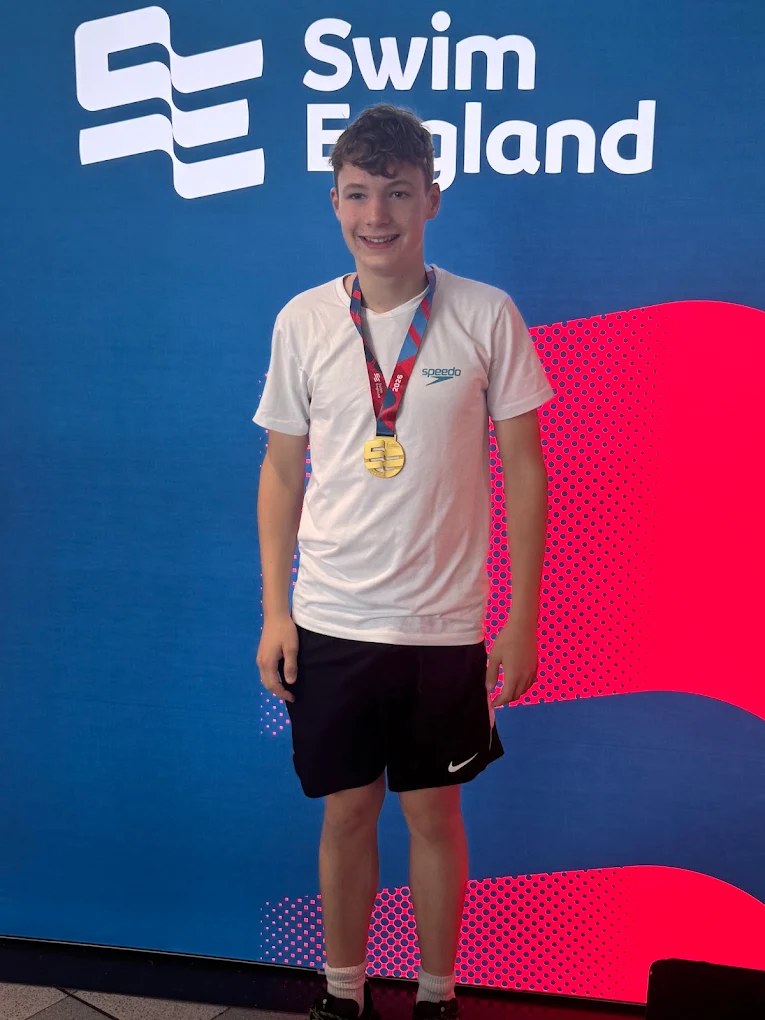 Harry Harriss with his Swim England national gold medal, who learned to swim with L&M Swimming Club in Caterham